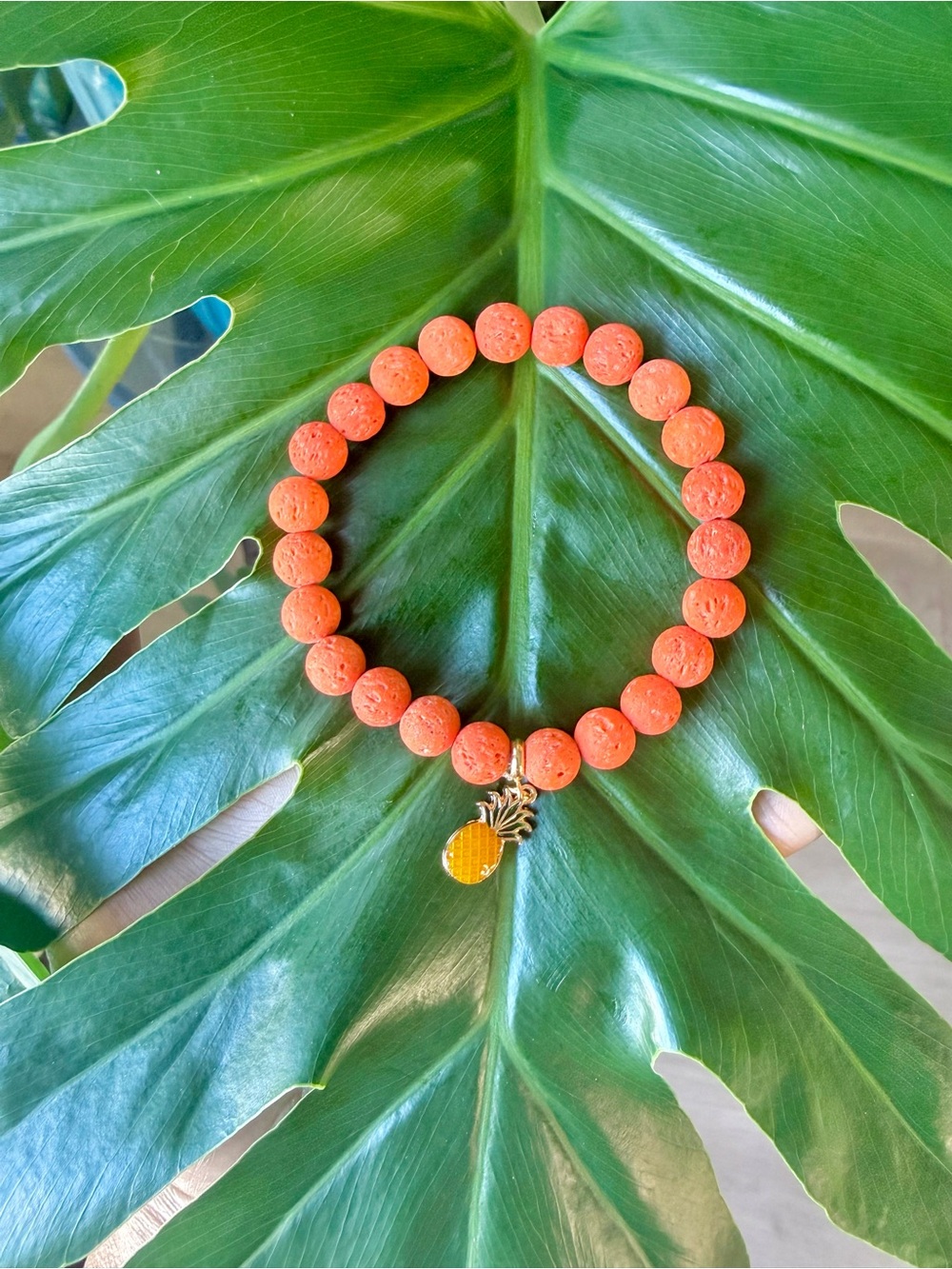 Lava stone bracelet with pineapple charm